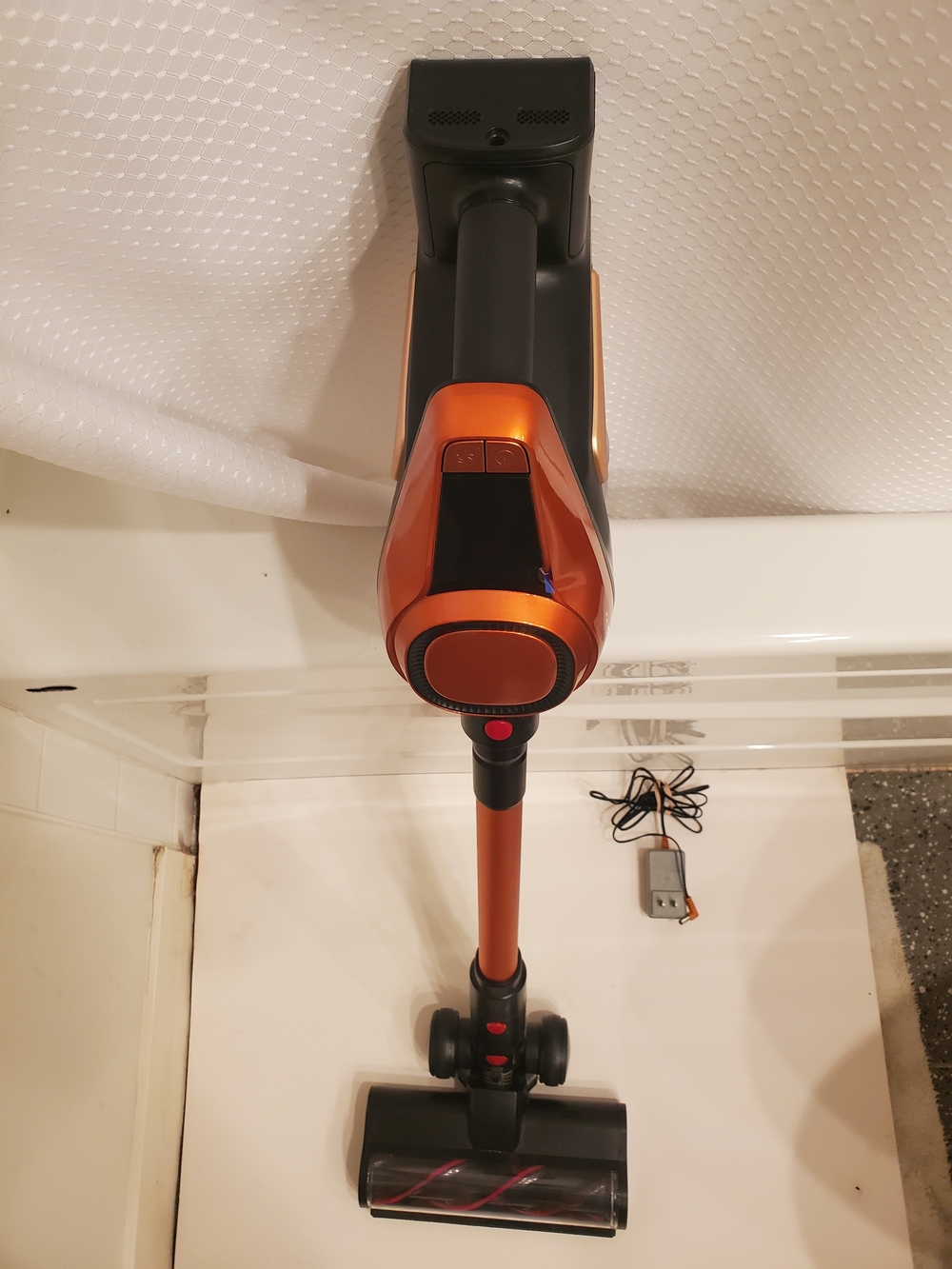 Cordless Stick Vacuum Cleaner in Metallic Orange and Black